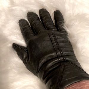Ladies black leather cashmere lined gloves.